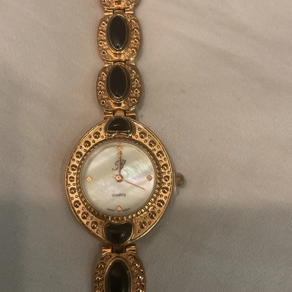 Elegant Gold and Black Women's Watch